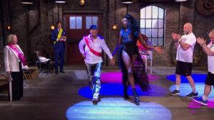 Business DragDiva demonstrating catwalk with Steven Bartlett on Dragons Den