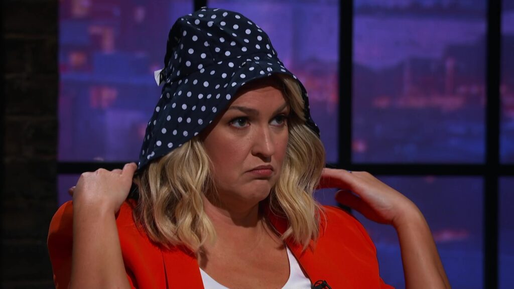 Dragon Sara Davies wearing the L'Hood rain hat