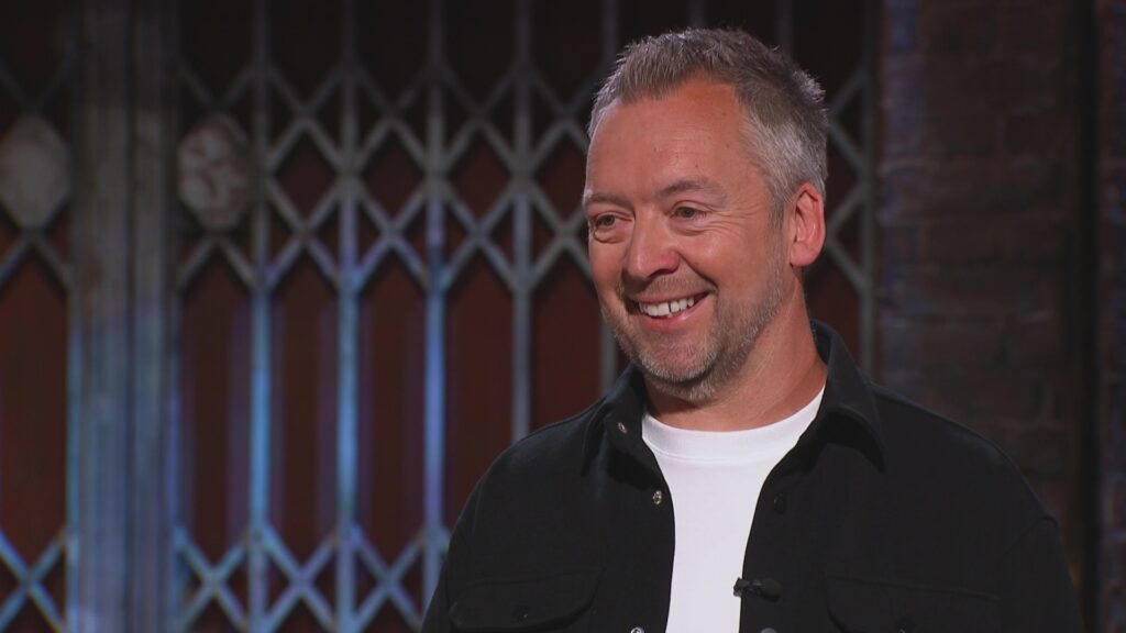 An image of James Martin, Glawning founder, smiling in the Den. 